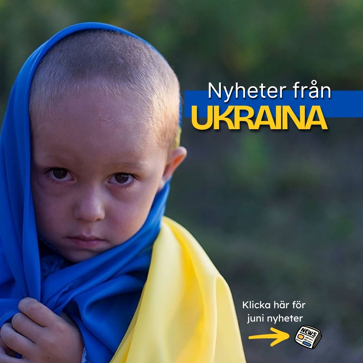 Ett barn insvept i Ukrainas flagga